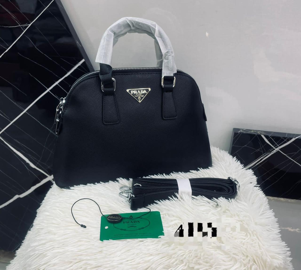 Prada-style nylon backpack with leather accents and logo plaque